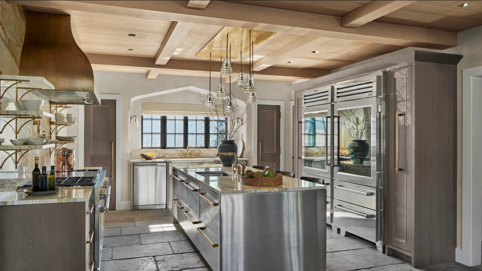 Luxury kitchen with marble island, brass fittings and integrated refrigeration